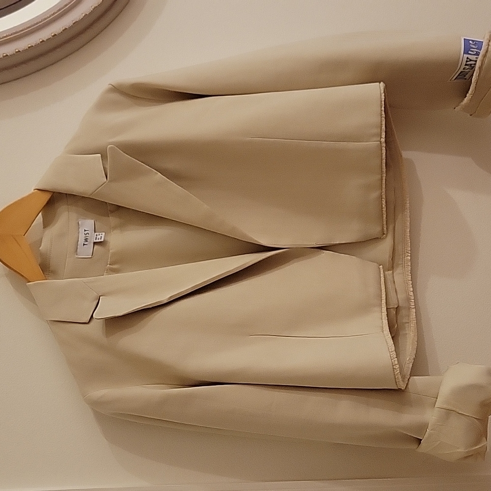 Short jacket and pants set. New no tags. Beige color. Size 8 US.